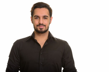 Obraz premium Young handsome Indian man looking at camera