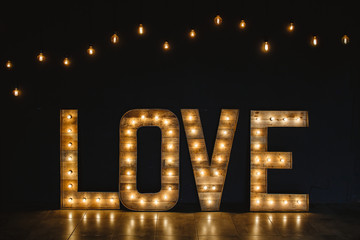 The word love wood with light.