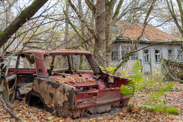 Abandoned car in Chernobyl Exclusion Zone during fall time