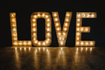 The word love wood with light.