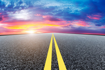 Empty highway asphalt pavement and sky cloud landscape..