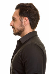 Profile view of young handsome Indian man