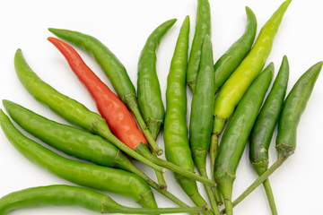 Green and red peppers isolated from white background.