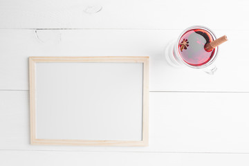 Christmas hot wine with orange, star anise and cinnamon over white background