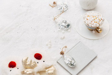 Top view, flat lay Cozy cup with marshmallow  on warm plaid. Holiday concept. Christmas composition.