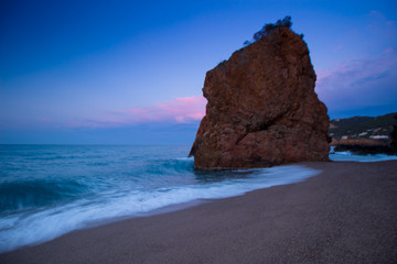 beach with rocks and sky