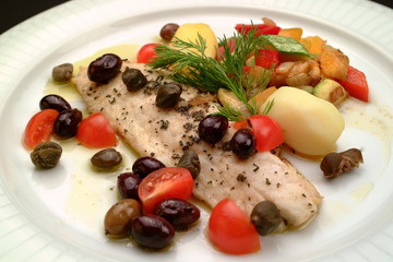 Italian food recipes, Ligurian branzino (sea bass) slice with olives, capers, tomatoes