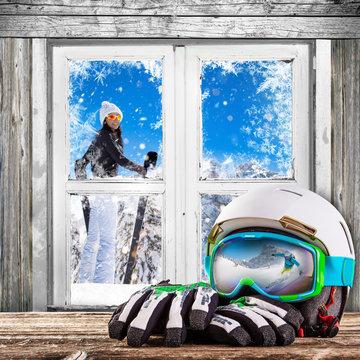 Winter old white window with ski helm and gloves.