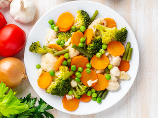 Mix of boiled vegetables, steam vegetables for dietary low-calorie diet. Broccoli, carrots, cauliflower, top view