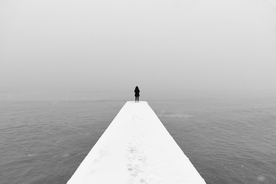 Woman on Winter Pier