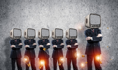 Businessmen with old TV instead of head.