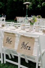 Mr and Mrs wedding ceremony setup flowers