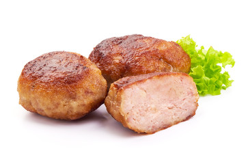 Roasted meatballs with lettuce, close-up, isolated on a white background.
