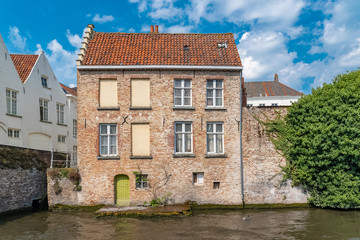 Fototapeta na wymiar Bruges in Belgium, beautiful typical houses on the canal