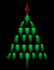 A Christmas tree made of guitar headstocks with a g-clef on top. 