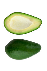 Avocado cut into two parts. Green avocado close up on white background