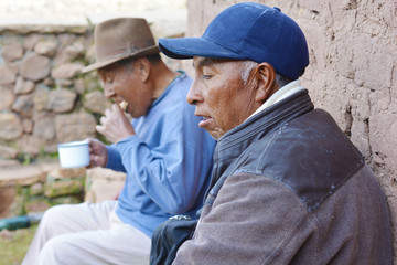Fototapeta na wymiar Native american old men eating outside.