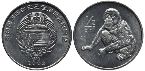 North Korea Korean aluminum coin 1/2 half won 2002, arms, sheaves flank dam with mountains behind and power line in front, sitting monkey right to value,