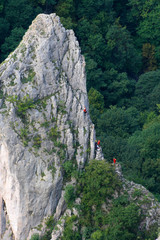 Climbers on the rock of Cukrova homola, Zadielska Valley, Slovak Karst, Slovakia - obrazy, fototapety, plakaty