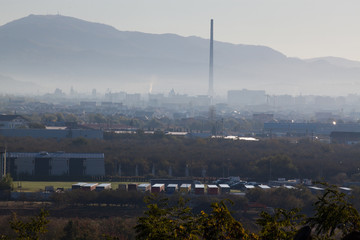 industrial town in early morning fog
