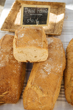 Fresh traditional french bread selling on a marketplace