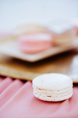 Multicolored tasty trendly macaroon on a plate