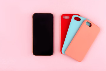 Set of colored plastic covers for smartphone isolated on a white background