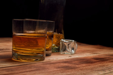 Glasses for whiskey on a wooden table