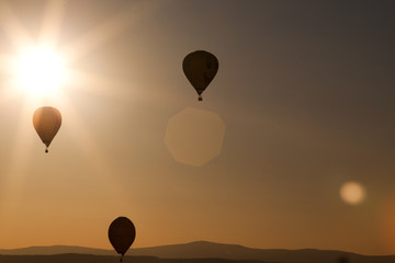 hot air balloons at sunset - freedom and adventure concept