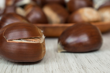 chestnut close-up with unfocused background on a wooden table