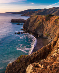 The warm tones of sunset on the cliffs of the Marin Headlands