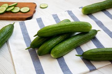 Fresh raw organic green cucumbers , low angle view. Closeup.