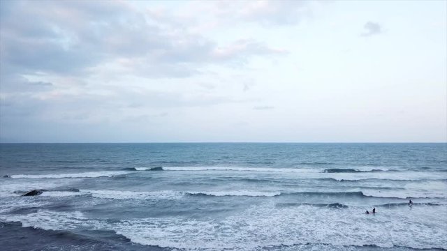 Drone footage of Baler, Philippines waves, surfing adults, and the awesome horizon of its sunset.