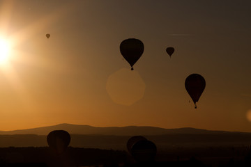 hot air balloons at sunset - freedom and adventure concept