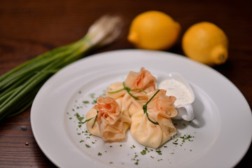 pancakes in the form of a bag with filling and sauce