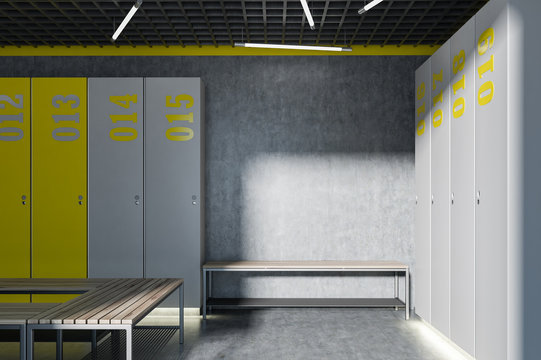 Gray and yellow locker room interior, bench