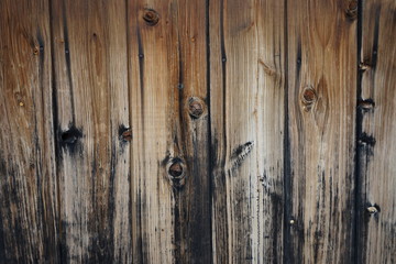 Brown wood plank wall. Boards with knots.
