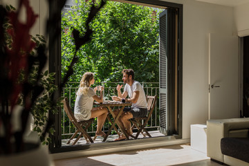 Adorable couple enjoying breakfast in summer