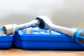 A set of heads in a blue box is not a focal point or a ratchet close-up. shallow depth of cut....