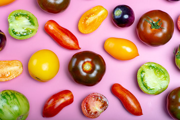 Flat lay top view food background with multicolored assortment of French fresh ripe tomatoes