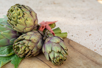 Fototapeta premium Traditional Italian food, fresh green artichoke vegetables, new harvest, uncooked