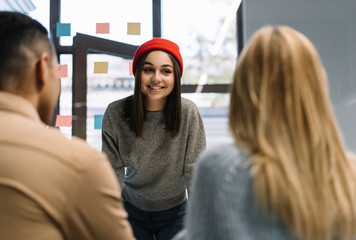 Group of happy multiracial university student wearing colorful hipsters clothes working together, collaborate, learning languages, exam preparation. Creative entrepreneurs discussion start up project.