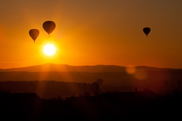hot air balloons at sunset - freedom and adventure concept