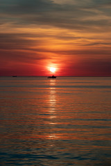 Silhouette of ship at sunset