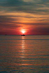 Silhouette of ship in sunset