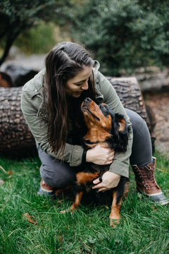 Woman Cuddling her Cute Dog!