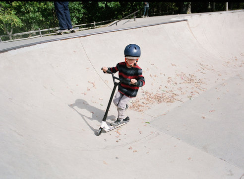 Boy on scooter at skate park