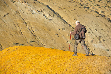 Man standing on rock. Mars mountains, the name of colored mountain protrusions in the mountains of...