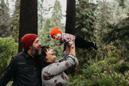 Parents Holding Baby up in the Air