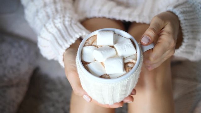 Hot Chocolate With Marshmallow In Woman Hand Wearing Knit Sweater